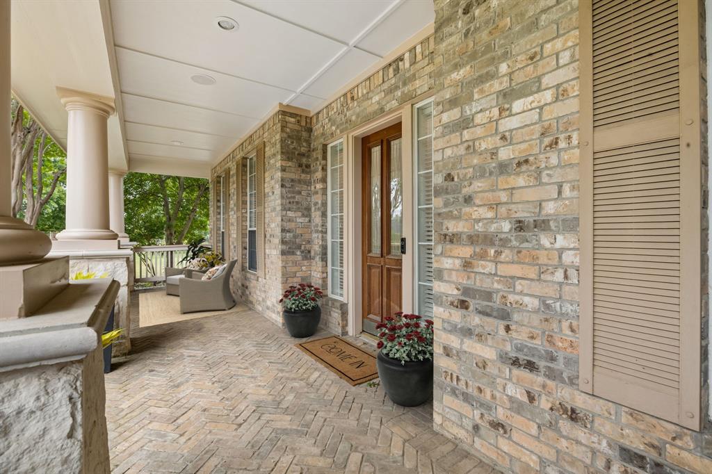 5808 Rathbone Drive Parker, TX 75002 - Photo 34 of 39 Striking covered front porch with herringbone patterned brick flooring is the perfect spot for engaging with the neighborhood and welcoming friends and family.