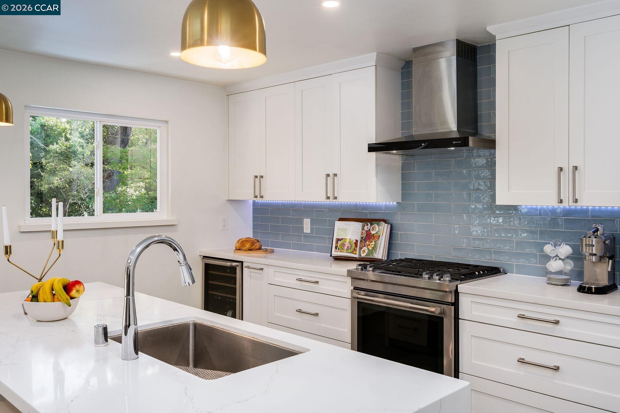 1886 Green Valley Road Alamo, CA 94507 - Photo 11 of 32 a kitchen with a sink a stove and cabinets