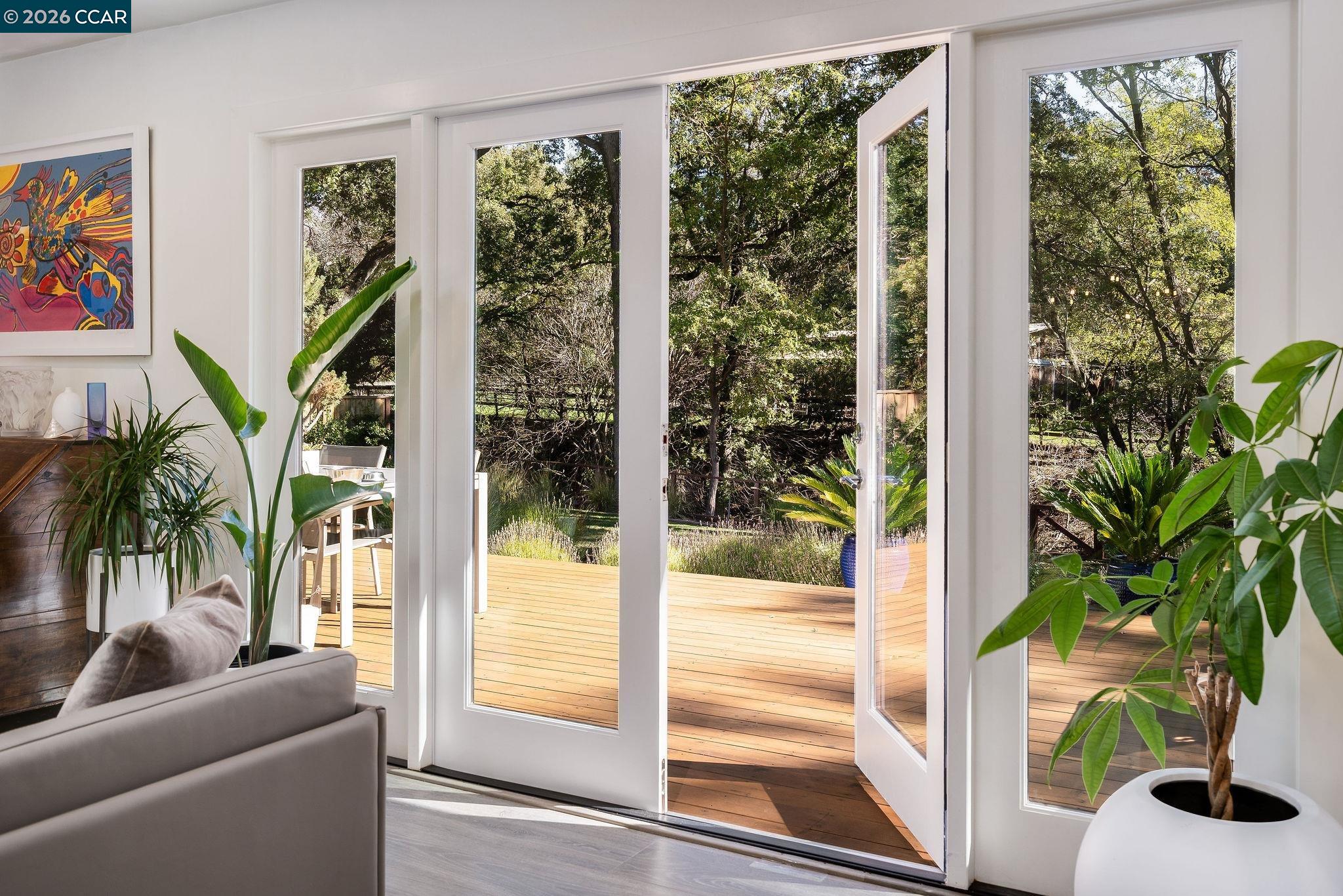 1886 Green Valley Road Alamo, CA 94507 - Photo 8 of 32 a living room with furniture and a potted plant