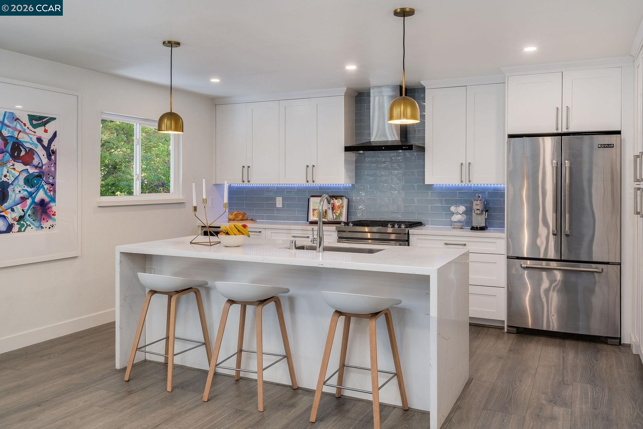 1886 Green Valley Road Alamo, CA 94507 - Photo 10 of 32 a kitchen with stainless steel appliances granite countertop a dining table chairs refrigerator and sink