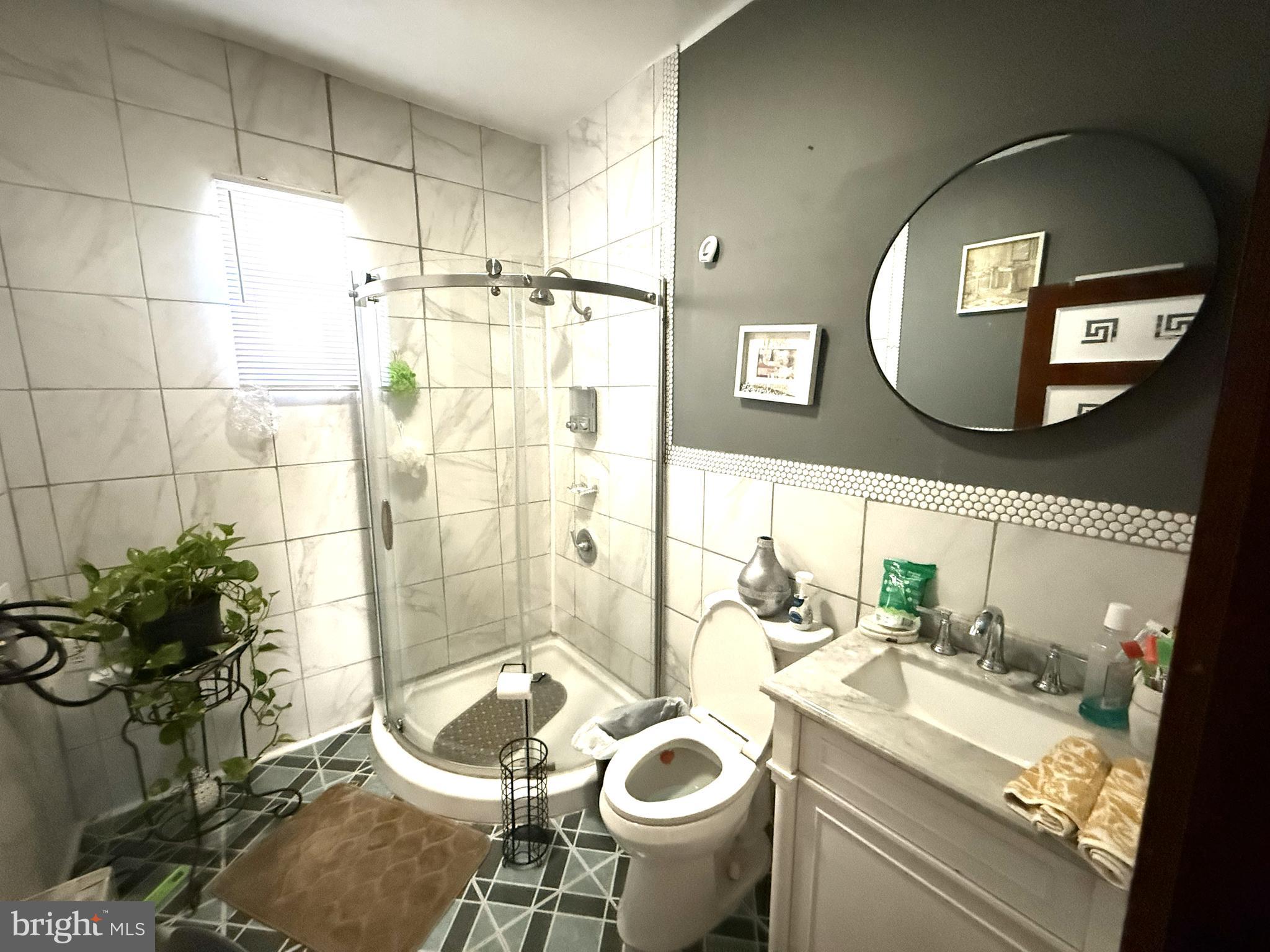 1666 Browning Road Pennsauken, NJ 08110 - Photo 6 of 12 a bathroom with a granite countertop sink mirror and tub