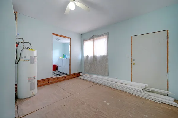 a bedroom with furniture and a window