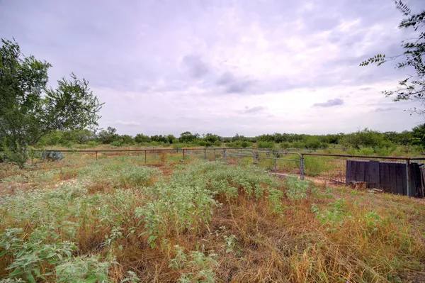 a view of a lake with houses in the back