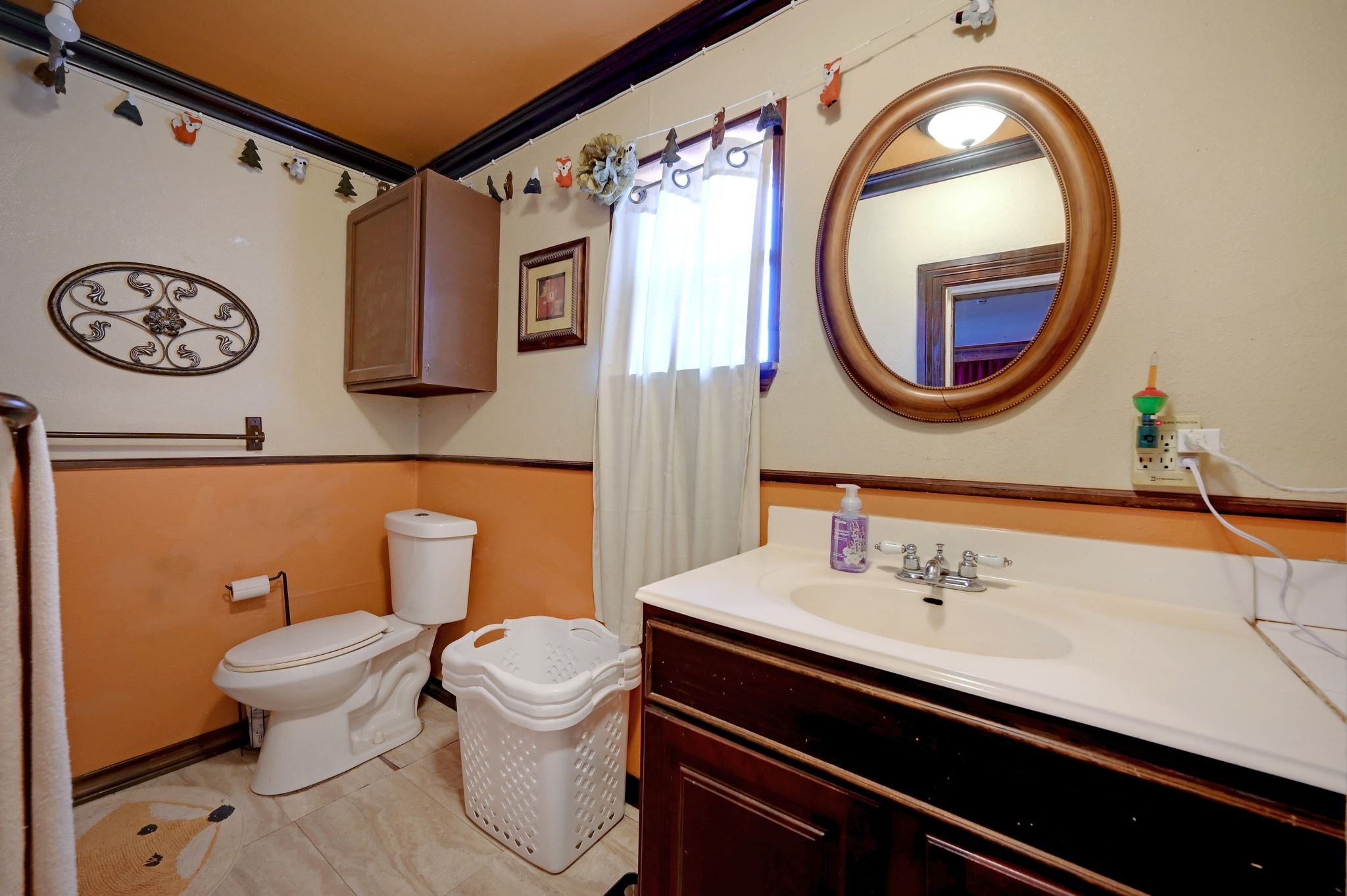 4598 Highway 173 Devine, TX 78016 - Photo 33 of 40 Bathroom with vanity, light tile patterned floors, and ornamental molding