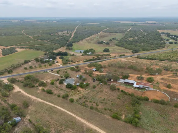 an aerial view of residential houses with outdoor space