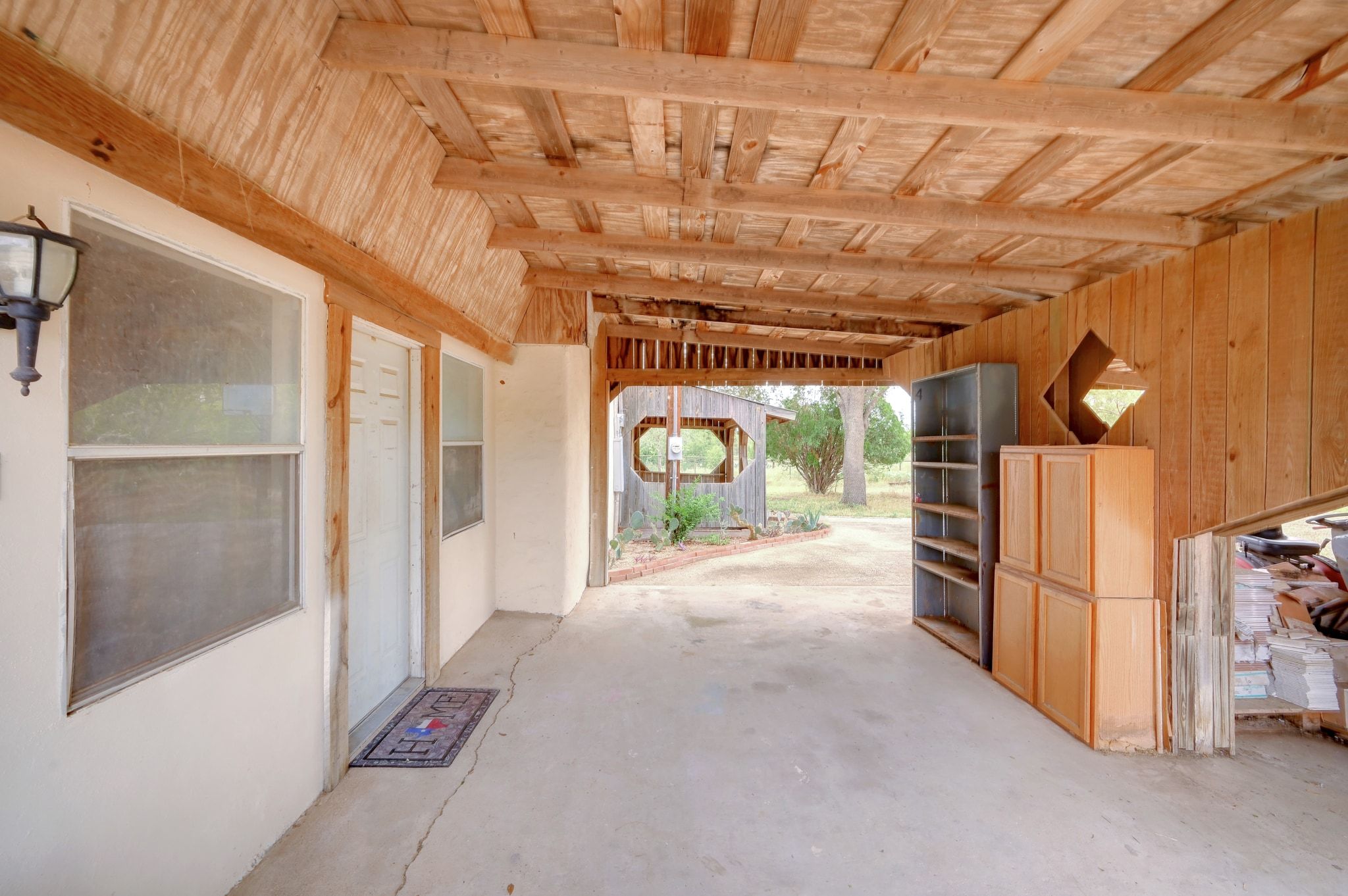 4598 Highway 173 Devine, TX 78016 - Photo 4 of 40 View of patio / terrace featuring an exterior structure and an outdoor structure