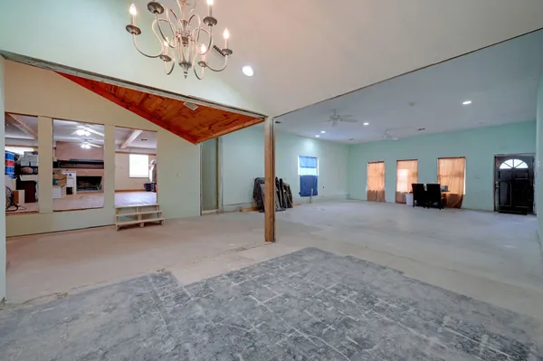 a view of a livingroom with furniture and a ceiling fan