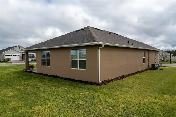 a kitchen with stainless steel appliances granite countertop a sink and a refrigerator
