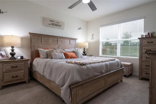 a bathroom with a shower sink and mirror