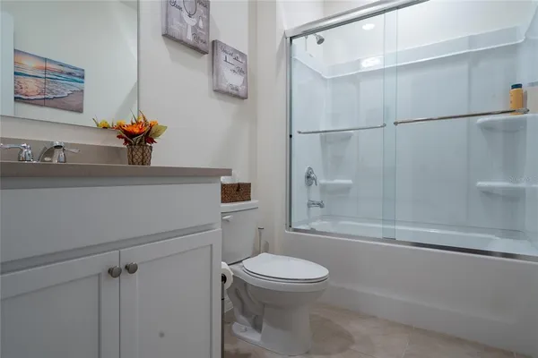 a room with gym equipment and windows