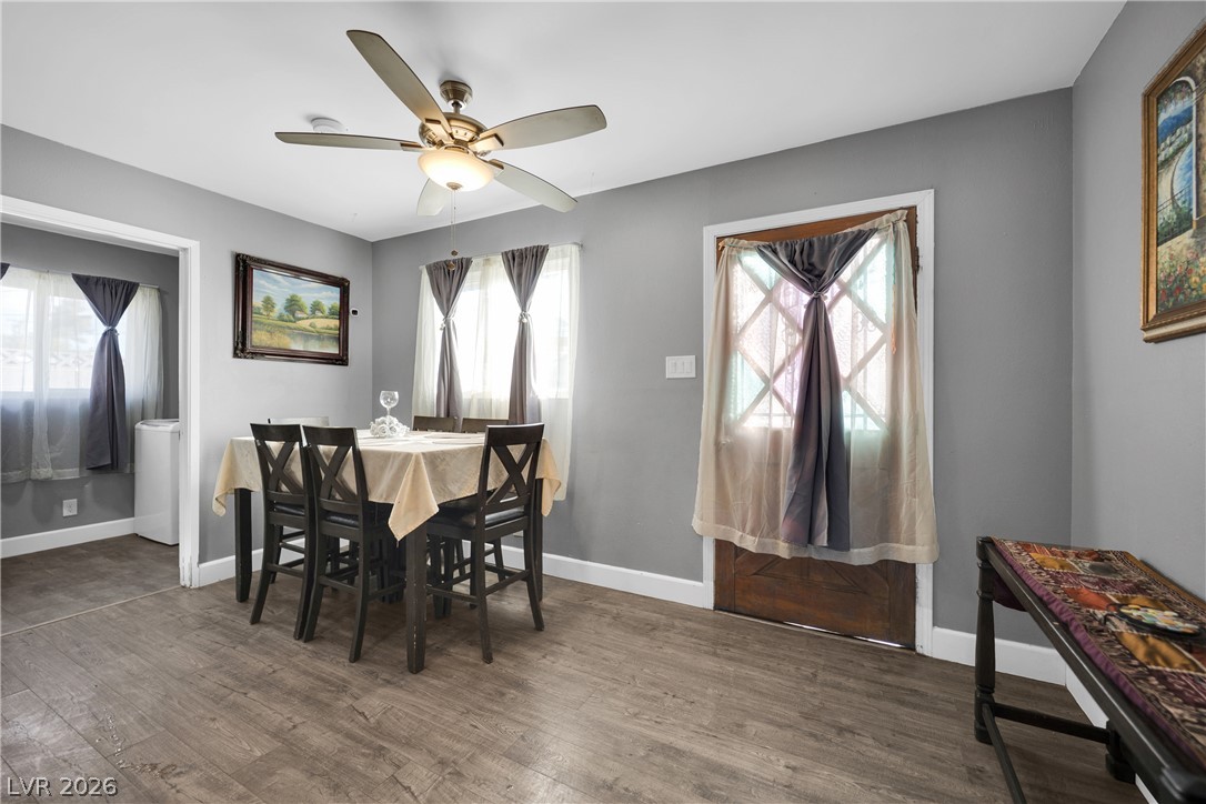 2221 Englestad Street North Las Vegas, NV 89030 - Photo 15 of 32 Natural light illuminates this dining area, complete with durable flooring and a ceiling fan for year-round comfort.