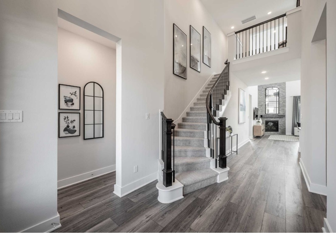 2723 Goodman Ridge Drive Rosharon, TX 77583 - Photo 6 of 15 a view of a hallway with wooden floor and staircase