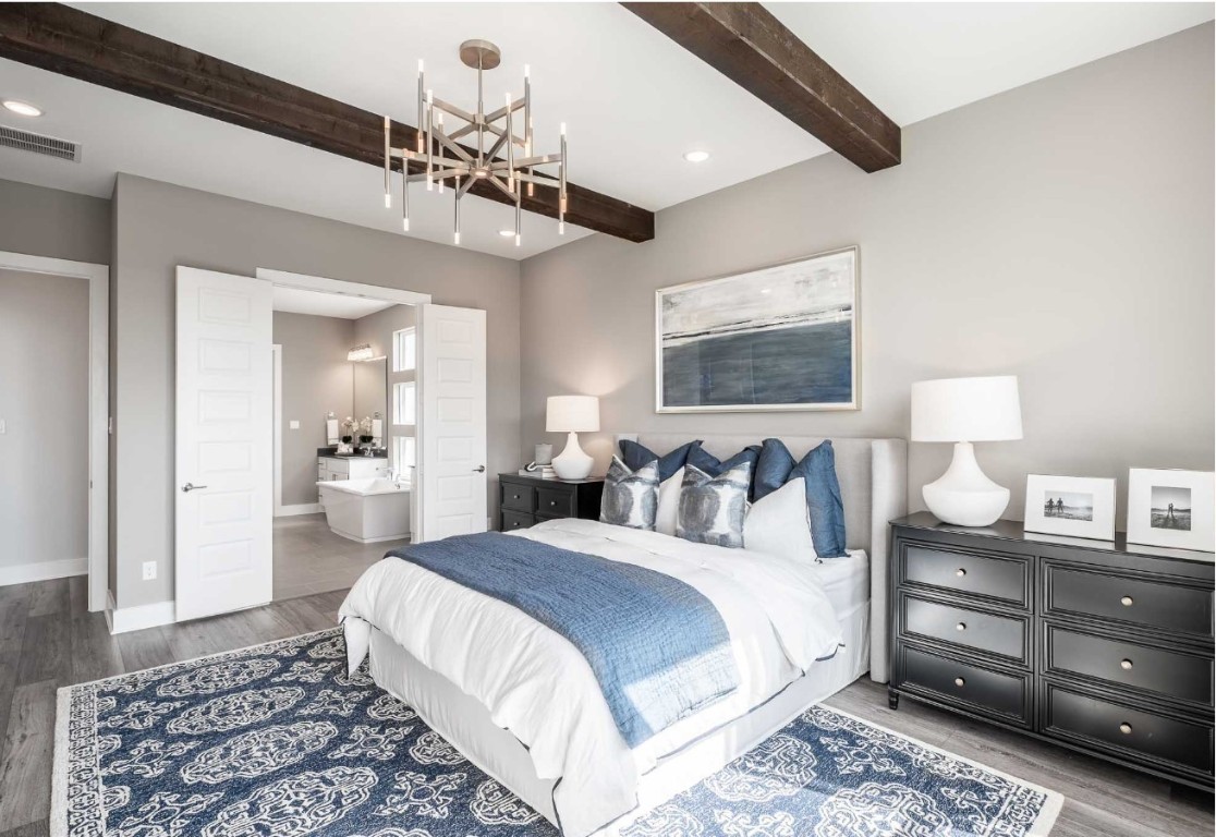 2723 Goodman Ridge Drive Rosharon, TX 77583 - Photo 10 of 15 a spacious bedroom with a bed and a chandelier