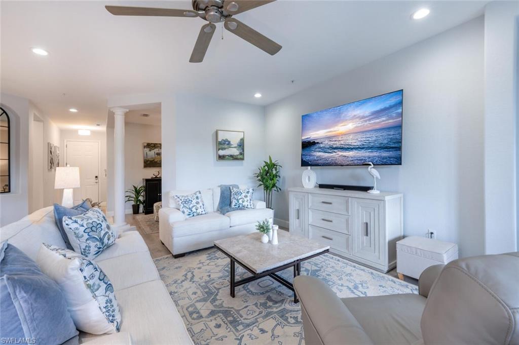 4650 Winged Foot Court, Unit 102 Naples, FL 34112 - Photo 6 of 34 Living room featuring ornate columns, a ceiling fan, and recessed lighting