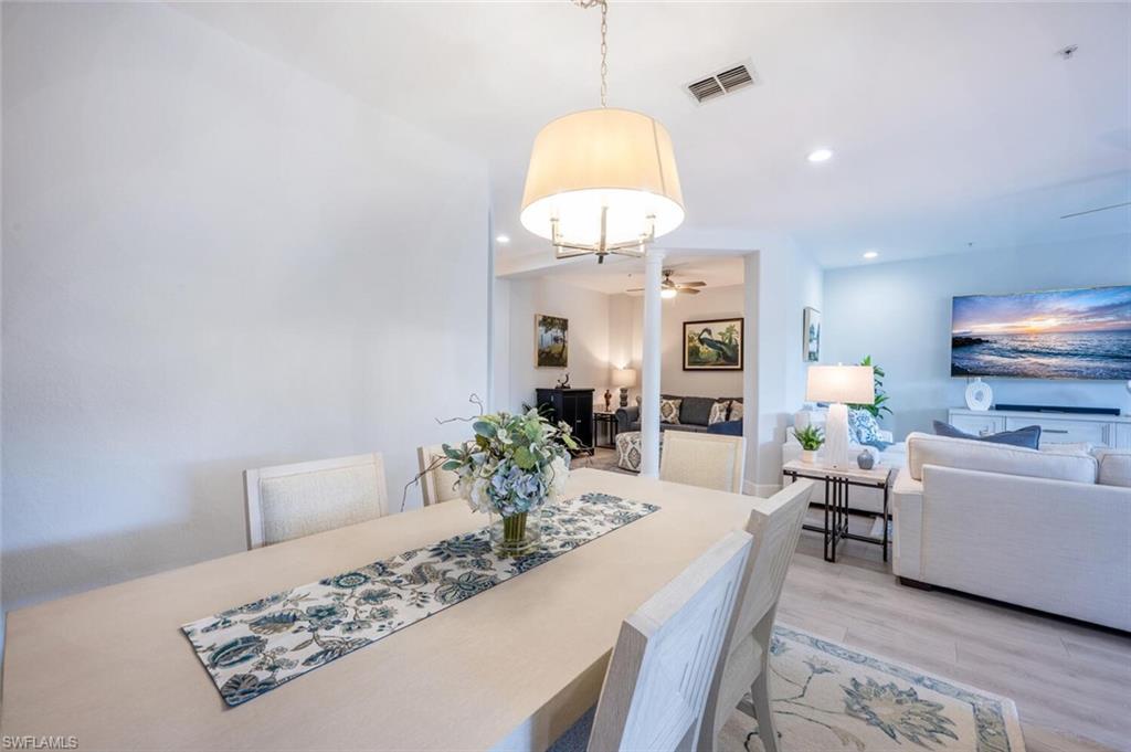 4650 Winged Foot Court, Unit 102 Naples, FL 34112 - Photo 8 of 34 Dining room with ceiling fan, light wood-style flooring, visible vents, and recessed lighting