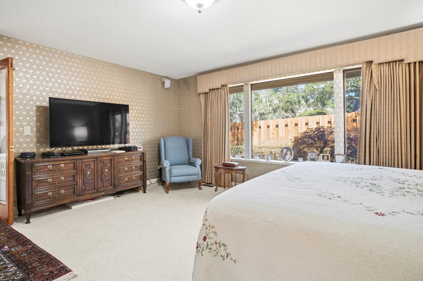 2911 Colton Road Pebble Beach, CA 93953 - Photo 25 of 46 a bedroom with furniture and a flat screen tv