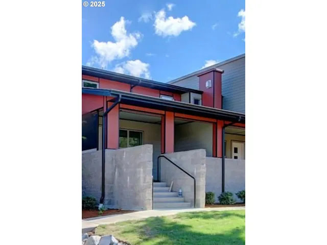 a view of a house with a small yard