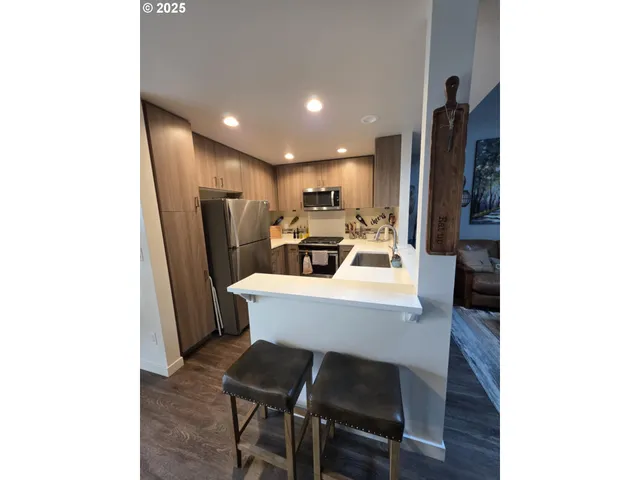 a kitchen with a table and chairs