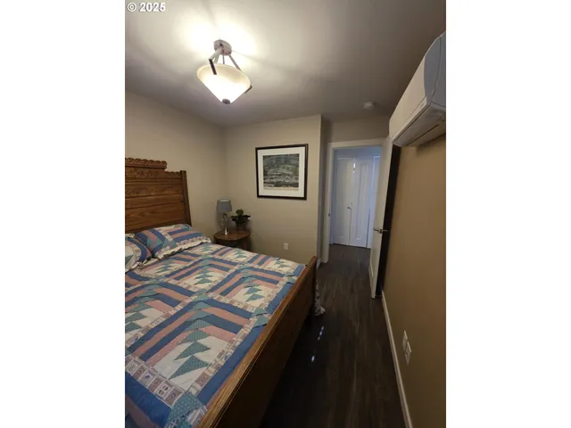 a bedroom with bed and a window