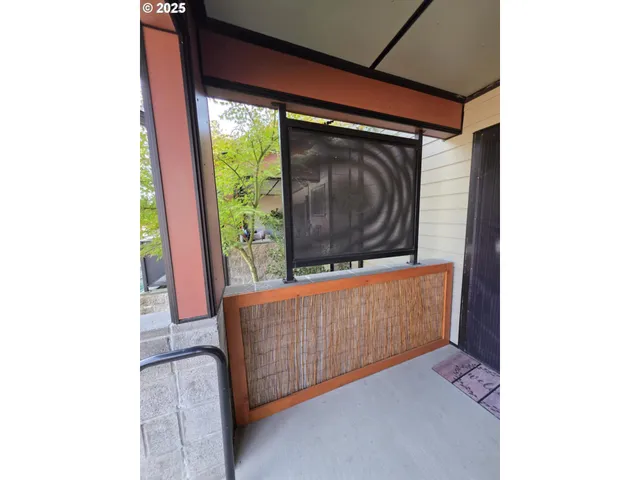 a living room with furniture and a yard