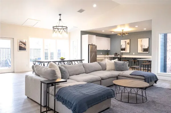 a living room with furniture and a large window