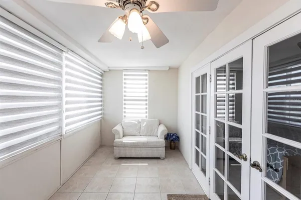 a spacious bedroom with a bed and a window