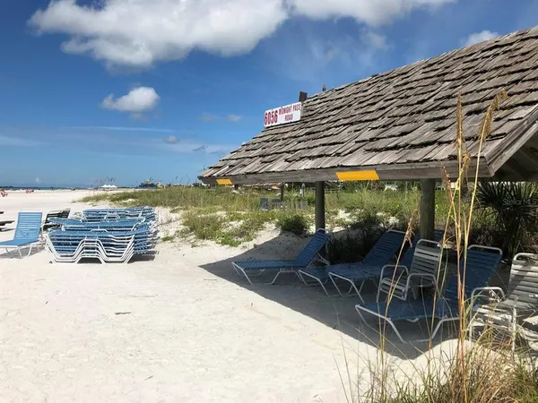 a view of a patio with table and chairs and potted plants
