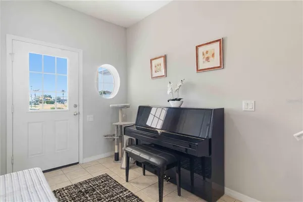 a kitchen with stainless steel appliances granite countertop a stove a sink a refrigerator white cabinets and wooden floor