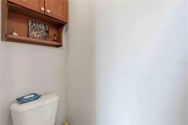 a bathroom with a sink toilet and mirror