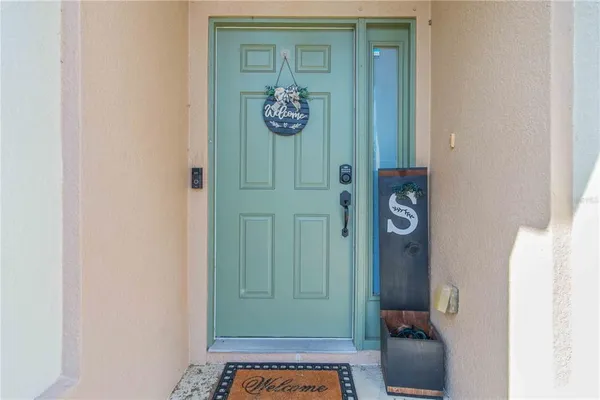 a view of an entryway with wooden floor