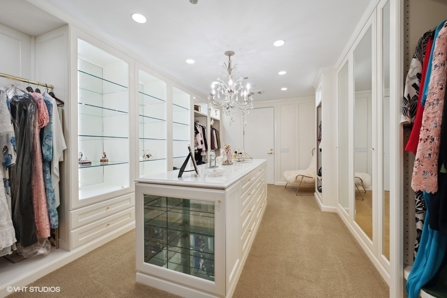 401 North Wabash Avenue, Unit 48A Chicago, IL 60611 - Photo 13 of 50 a bathroom with a sink a mirror and a shower