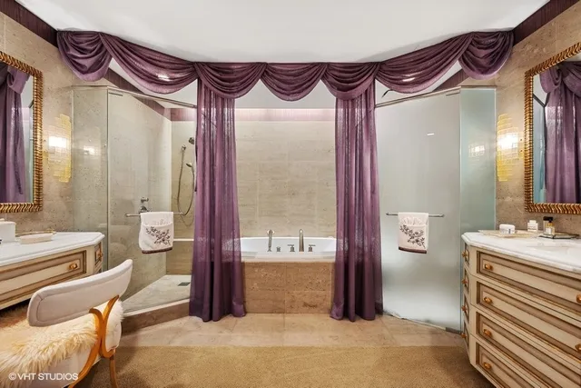 a bathroom with a bathtub and a shower