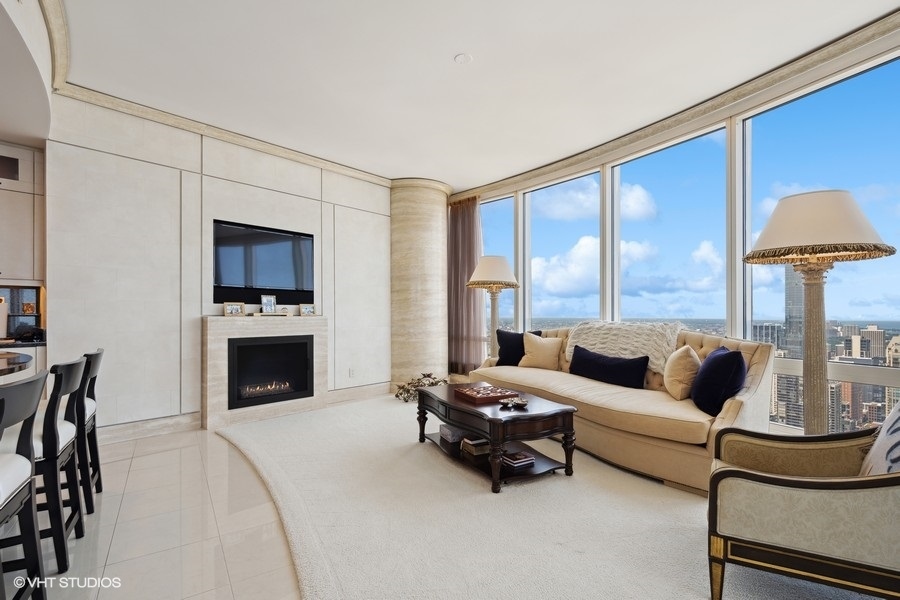 401 North Wabash Avenue, Unit 48A Chicago, IL 60611 - Photo 24 of 50 a living room with furniture and a fireplace