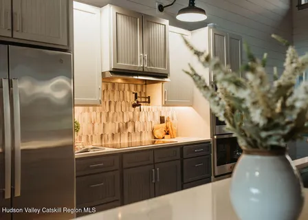 a kitchen with a sink and wooden cabinets