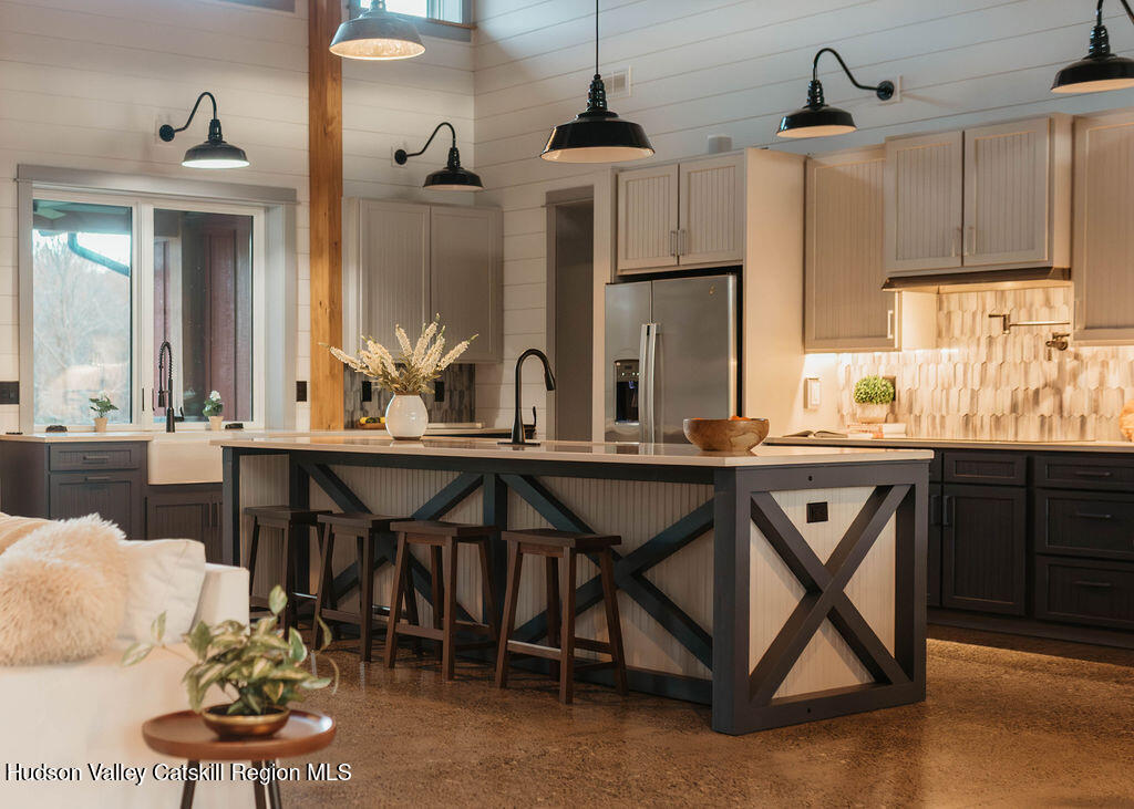 1248 Albany Post Road Gardiner, NY 12525 - Photo 14 of 44 a kitchen with a table chairs stove and cabinets