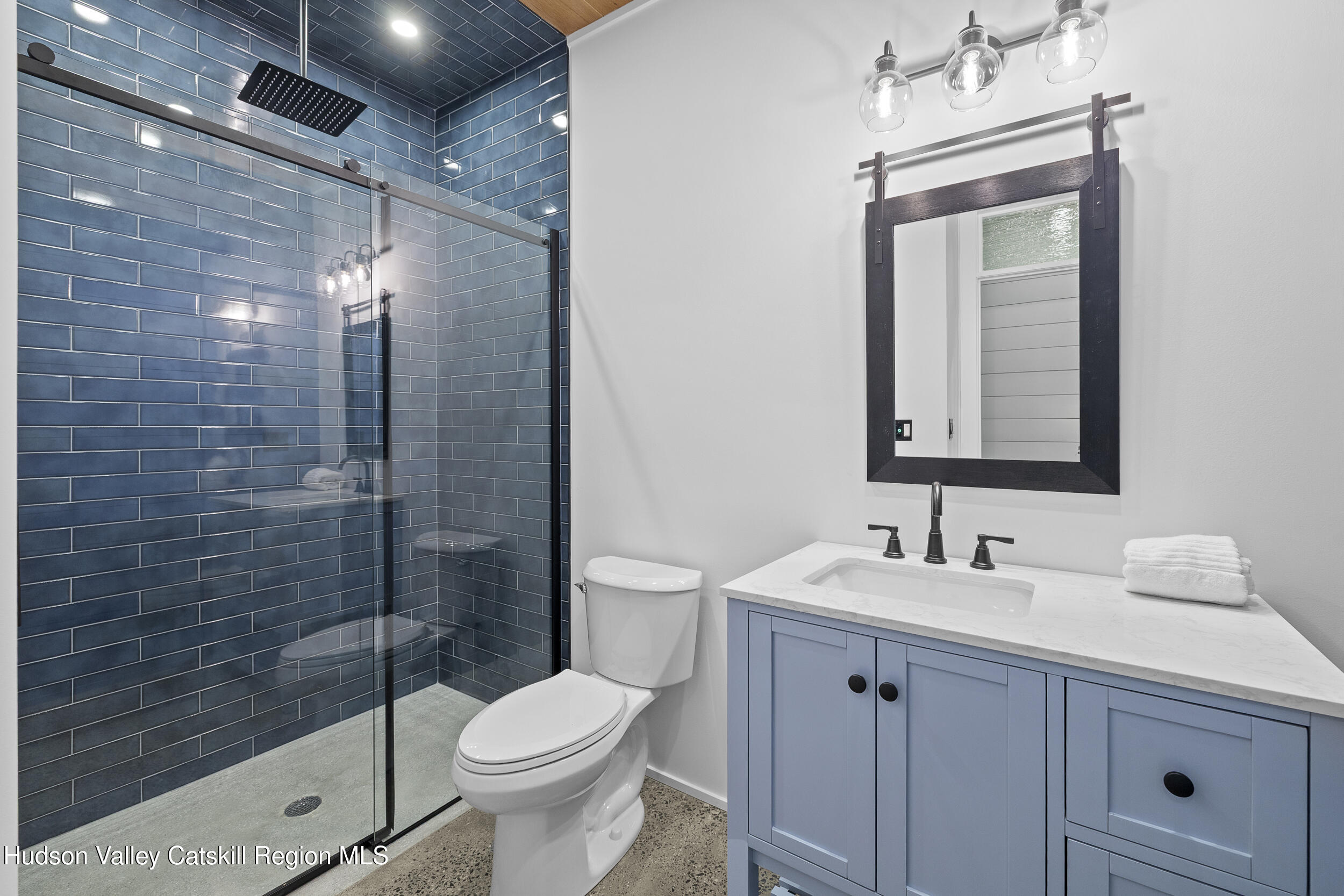 1248 Albany Post Road Gardiner, NY 12525 - Photo 26 of 44 a bathroom with a toilet sink and shower