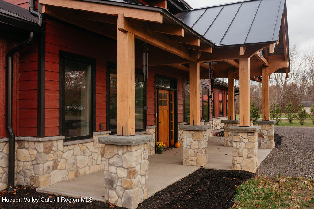1248 Albany Post Road Gardiner, NY 12525 - Photo 37 of 44 a view of a patio with table and chairs potted plants