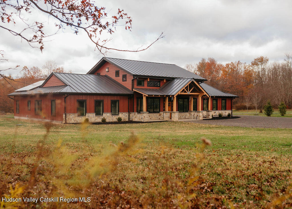 1248 Albany Post Road Gardiner, NY 12525 - Photo 38 of 44 a front view of a house with a yard