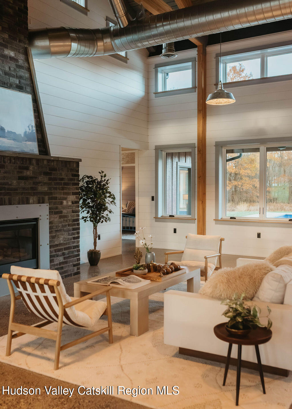 1248 Albany Post Road Gardiner, NY 12525 - Photo 6 of 44 a living room with furniture wooden floor and a fireplace