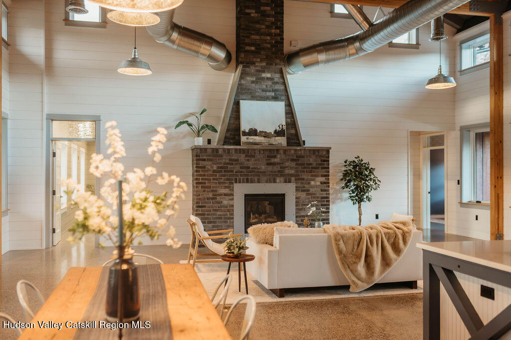 1248 Albany Post Road Gardiner, NY 12525 - Photo 7 of 44 a living room with furniture and a fireplace