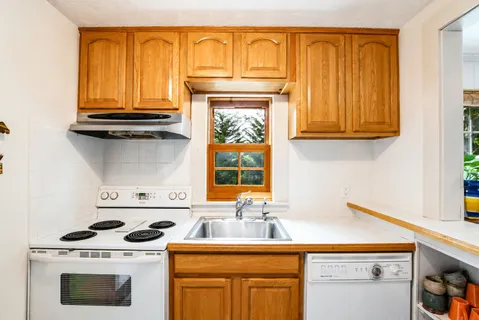 a kitchen with a stove and a sink