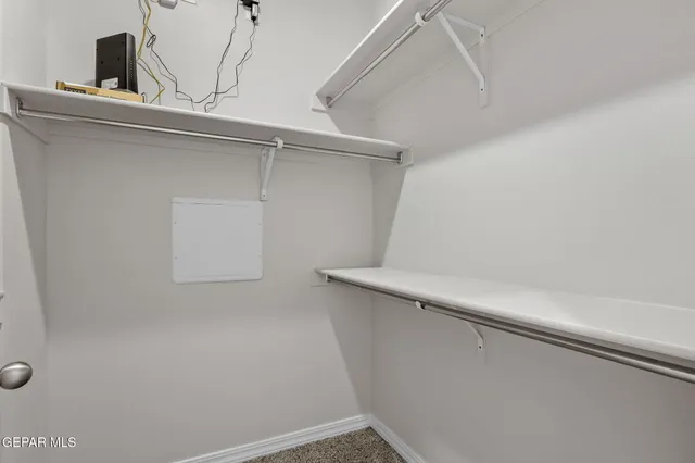 a bathroom with a granite countertop sink a toilet a mirror and bathtub