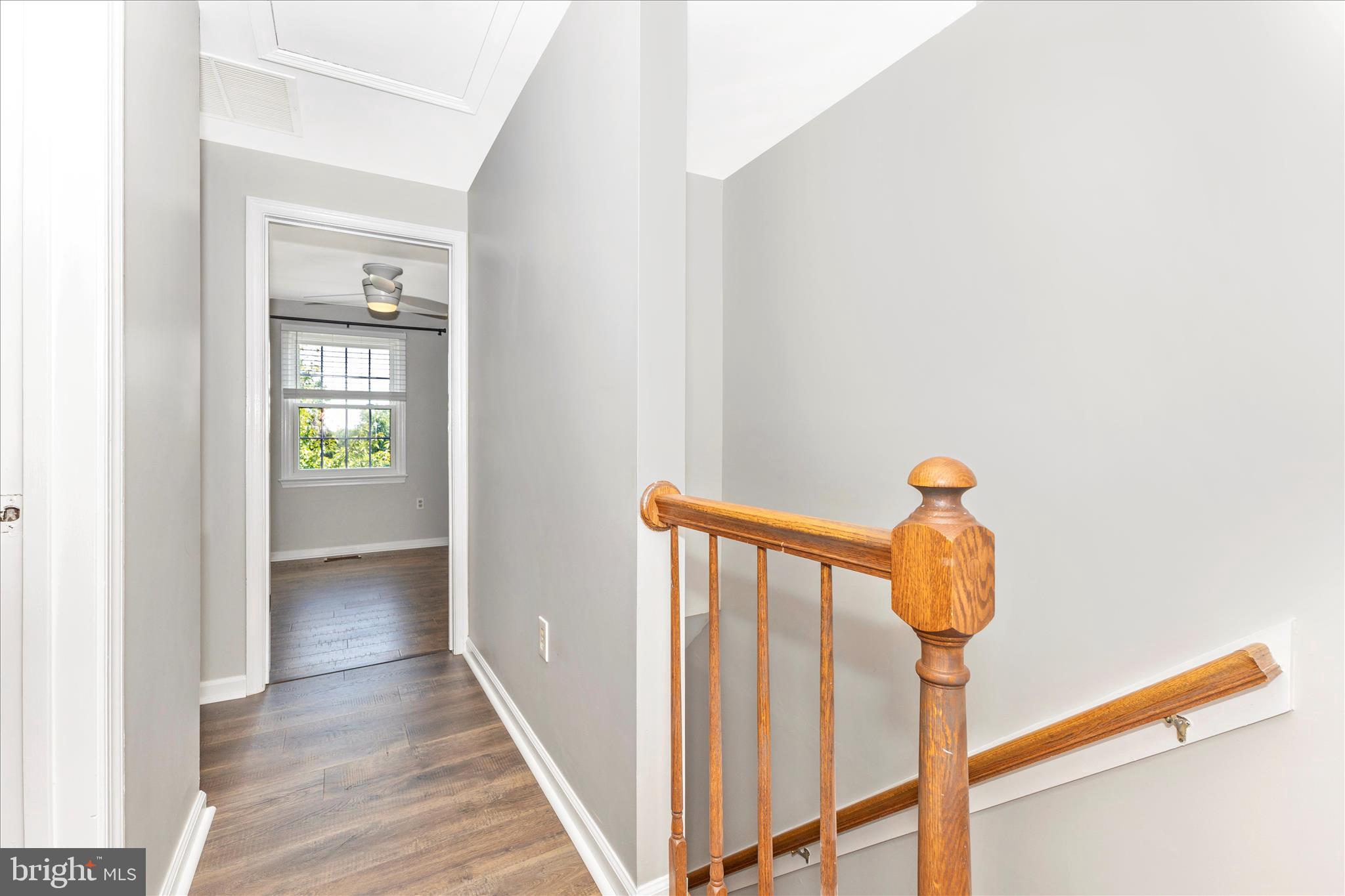 8204 Red Wing Court Frederick, MD 21701 - Photo 15 of 58 a view of a hallway with wooden floor