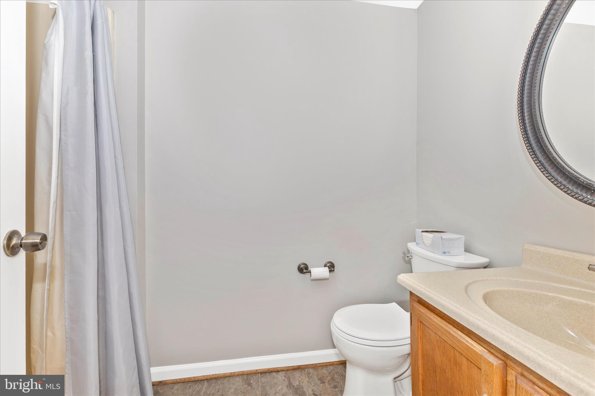 8204 Red Wing Court Frederick, MD 21701 - Photo 17 of 58 a white toilet sitting next to a bathroom sink