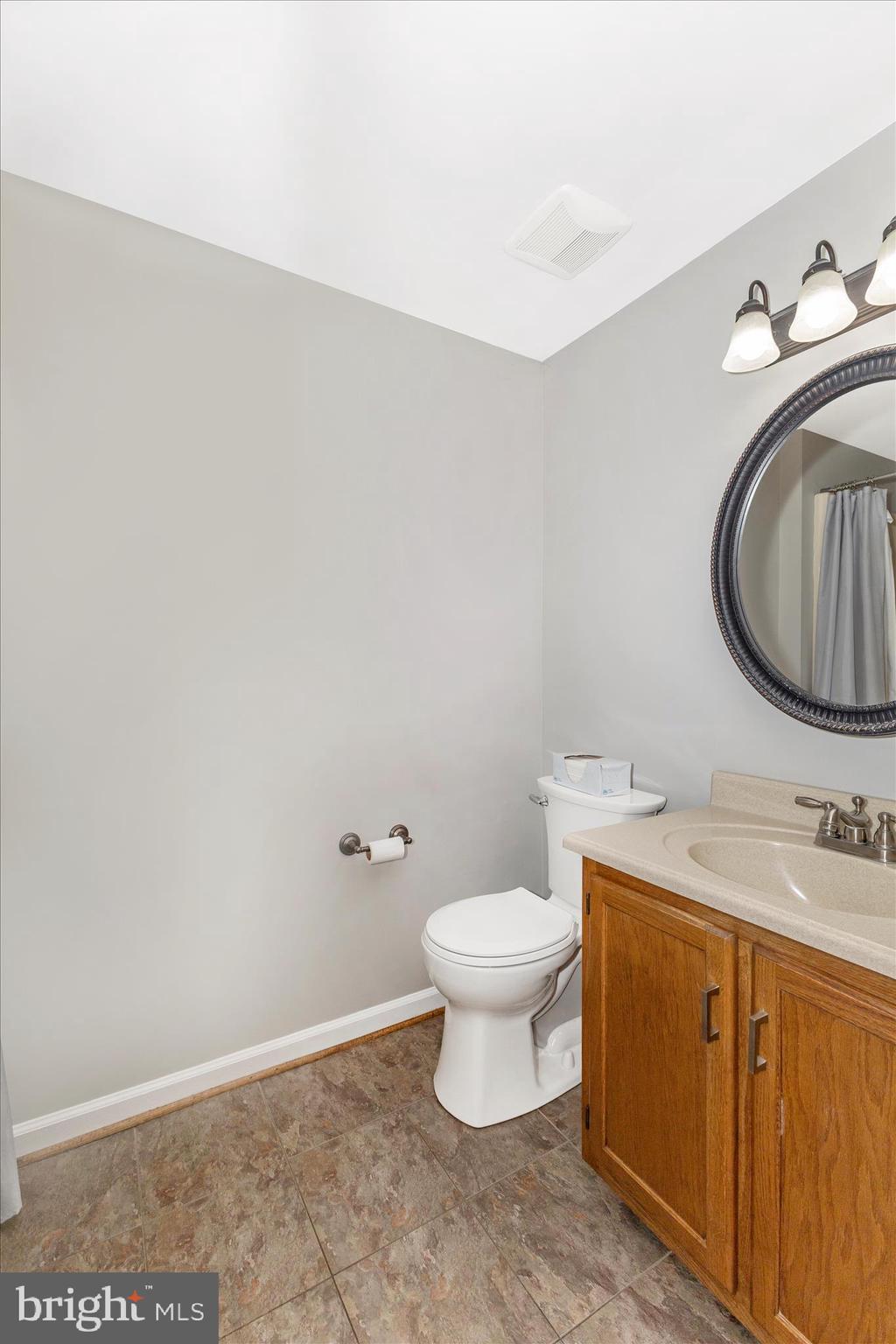 8204 Red Wing Court Frederick, MD 21701 - Photo 19 of 58 a bathroom with a sink toilet and a mirror