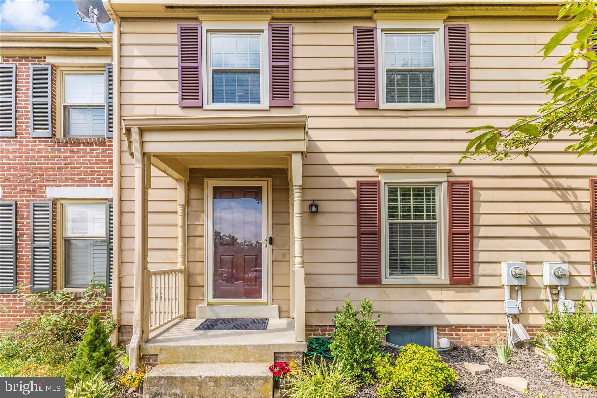 8204 Red Wing Court Frederick, MD 21701 - Photo 2 of 58 a front view of a house with a yard