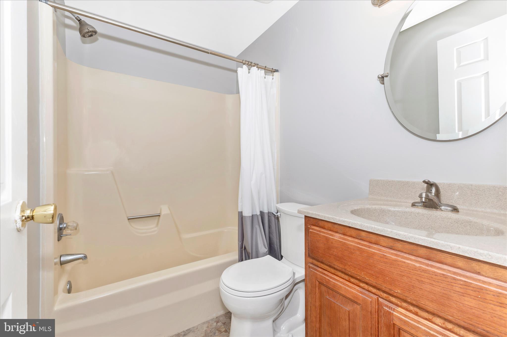 8204 Red Wing Court Frederick, MD 21701 - Photo 22 of 58 a bathroom with a granite countertop sink toilet and shower