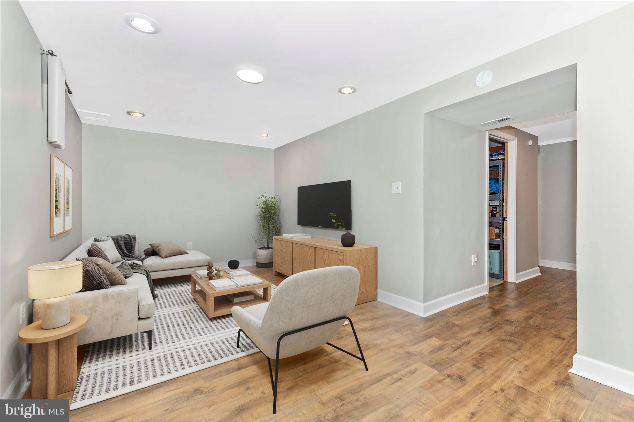 8204 Red Wing Court Frederick, MD 21701 - Photo 23 of 58 a living room with furniture and a flat screen tv