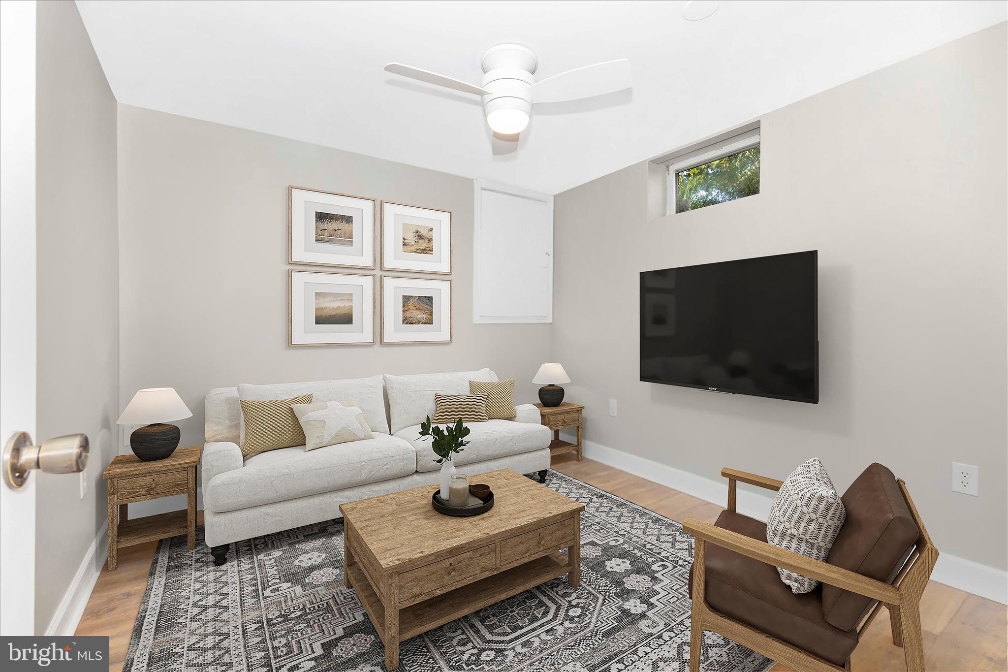 8204 Red Wing Court Frederick, MD 21701 - Photo 24 of 58 a living room with furniture and a flat screen tv