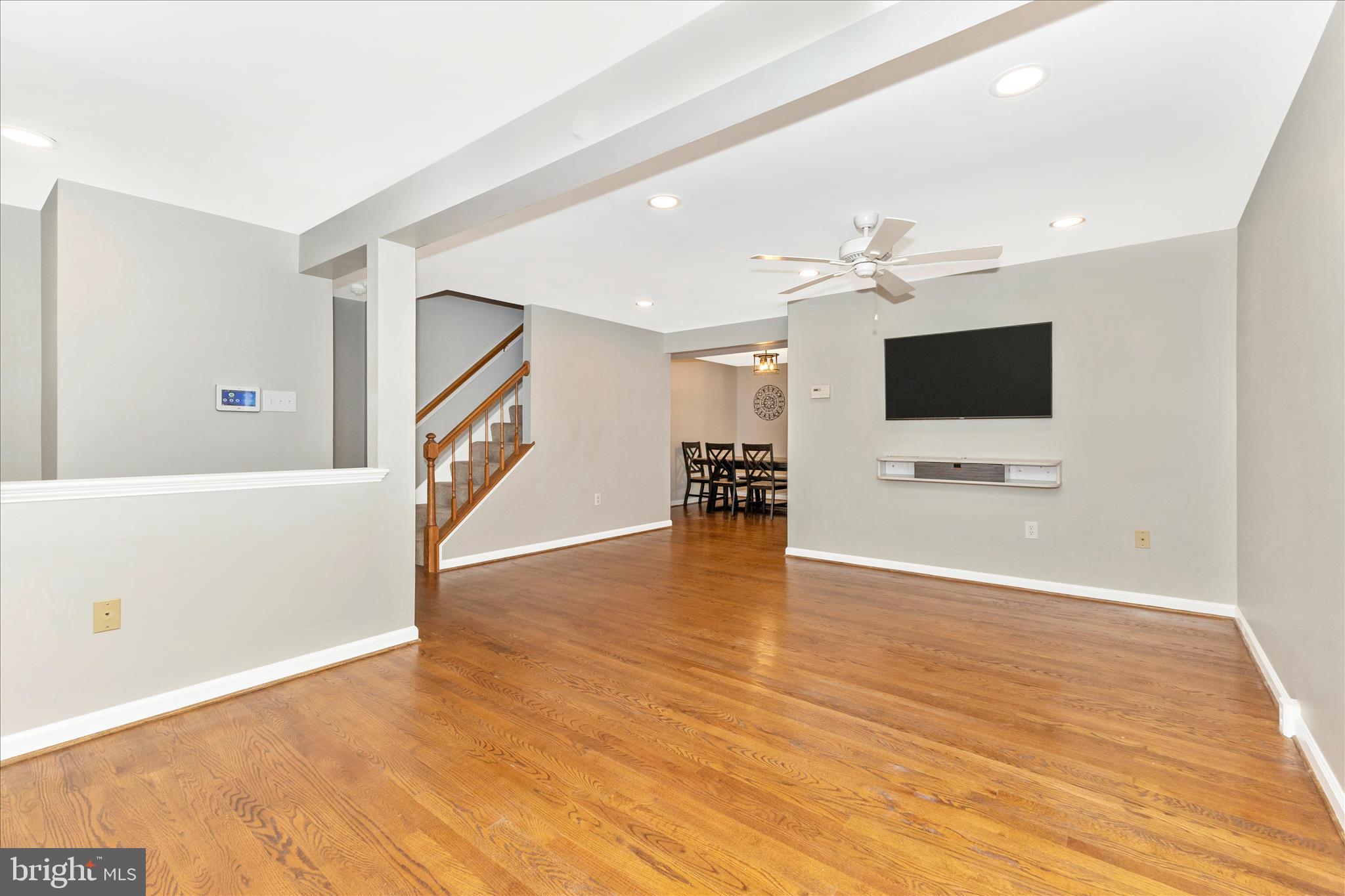 8204 Red Wing Court Frederick, MD 21701 - Photo 7 of 58 a view of a livingroom with wooden floor and a flat screen tv